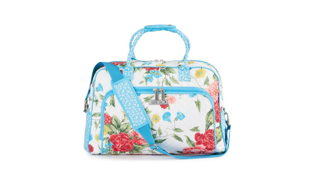 Floral cloth weekender bag with exterior zipper pouches and handles. 