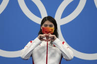 Zhang Yufei of China gestures on the podium after winning the women's 200-meter butterfly final at the 2020 Summer Olympics, Thursday, July 29, 2021, in Tokyo, Japan. (AP Photo/Matthias Schrader)