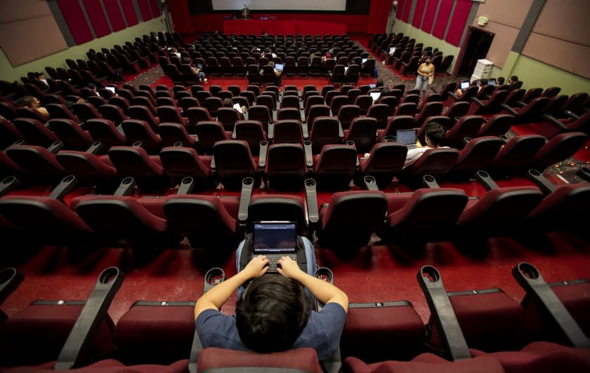 RIVERSIDE, CA - MAY 26, 2022: College students attend a Criminology class inside a movie theatre about a mile from the UC Riverside campus because the campus has a lack of classroom space on May 26, 2022 in Riverside, California. A new bill by Assemblyman Jose Medina is suppose to give more funding to UCR for renovations.(Gina Ferazzi / Los Angeles Times)