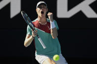 Denis Shapovalov of Canada celebrates after winning the fourth set against Rafael Nadal of Spain during their quarterfinal match at the Australian Open tennis championships in Melbourne, Australia, Tuesday, Jan. 25, 2022. (AP Photo/Andy Brownbill)