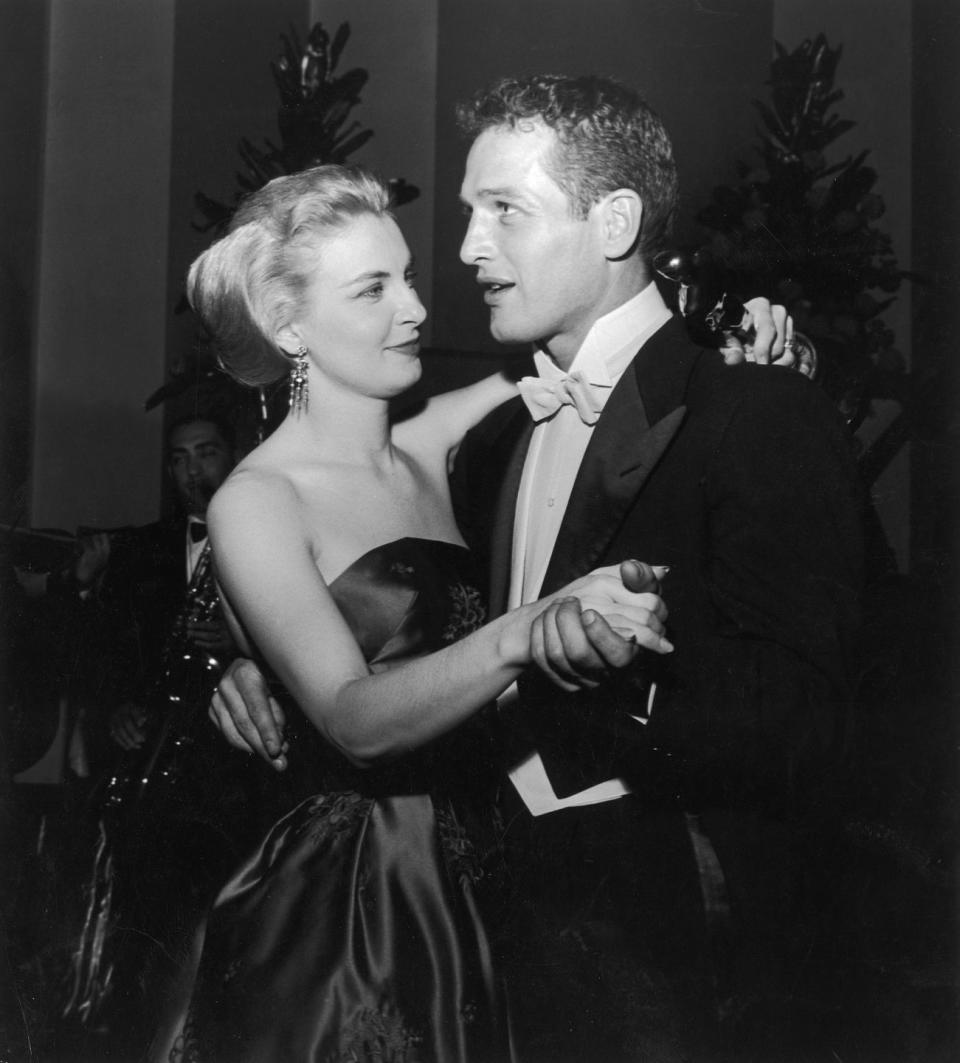 married american actors paul newman and joanne woodward share a dance as woodward holds her best actress oscar statuette, during the academy awards party at the beverly hilton, beverly hills, california, march 26, 1958 woodward won the award for her starring role in the film, the three faces of eve, directed by nunnally johnson photo by darlene hammondgetty images