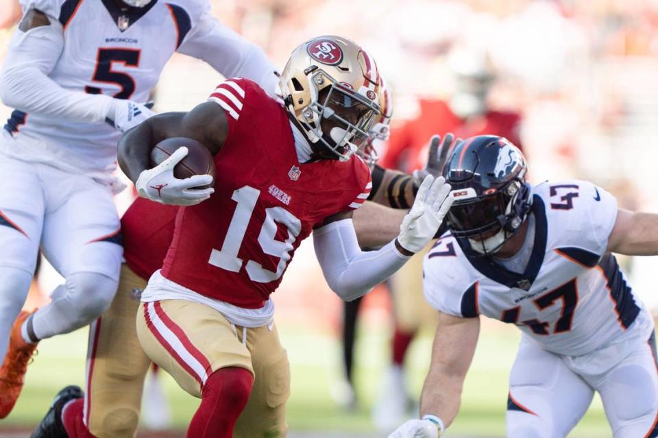 Aug 19, 2023; Santa Clara, California, USA; San Francisco 49ers wide receiver Deebo Samuel (19) runs during the first quarter against Denver Broncos linebacker Josey Jewell (47) and linebacker Randy Gregory (5) at Levi’s Stadium. Mandatory Credit: Stan Szeto-USA TODAY Sports