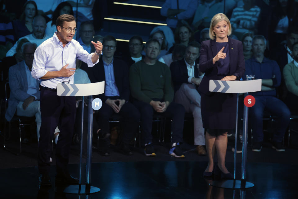 Ulf Kristersson, leader of the Moderate party, left, and Prime minister Magdalena Andersson, leader of the Social Democrats take part in a political debate broadcasted on TV4 from Eskilstuna, Sweden, Thursday Sept. 8, 2022. General elections will be held in Sweden on September 11. (Christine Olsson/TT via AP)