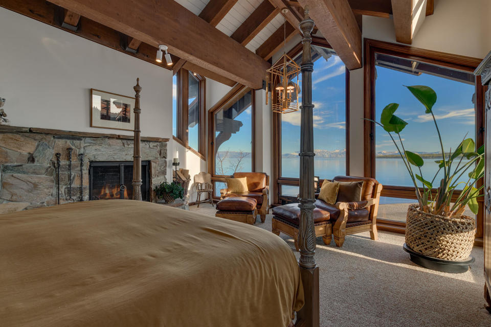 Floor-to-ceiling windows provide gorgeous views of the lake from the master bedroom.