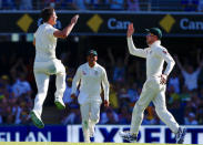 Cricket - Ashes test match - Australia v England - GABBA Ground, Brisbane, Australia, November 23, 2017. Australia's Pat Cummins celebrates with team mates after bowling England's Mark Stoneman during the first day of the first Ashes cricket test match. REUTERS/David Gray