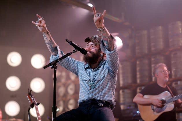 Post Malone has been everywhere from the Opry to a beloved Nashville record store this week, as he promotes 'F-1 Trillion.' - Credit: Getty Images for Bud Light