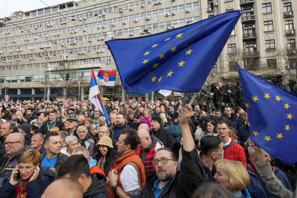 Protesters wave EU flags during a rally in downtown Belgrade, Serbia, Saturday, Dec. 30, 2023. Thousands of people gathered to protest what election observers said were widespread vote irregularities during a recent general election. (AP Photo/Darko Vojinovic)