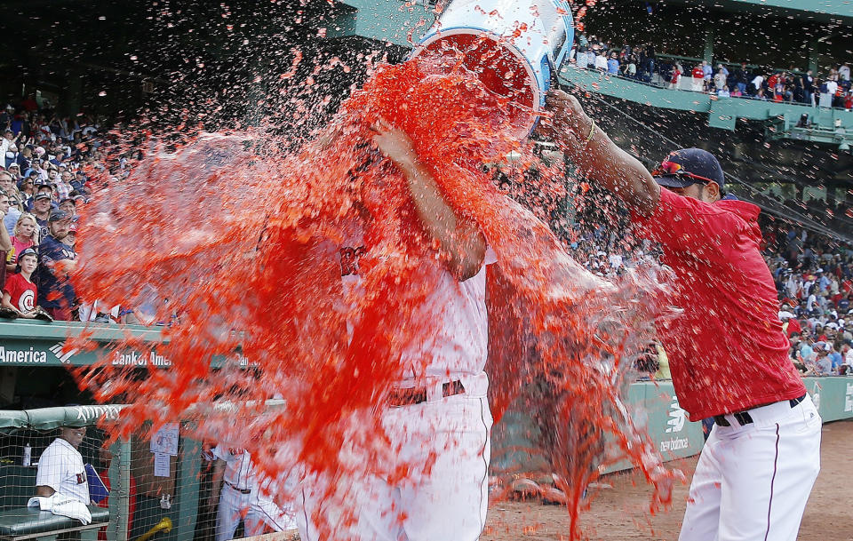 <p>Teammates douse Boston Red Sox’s Xander Bogaerts after the Red Sox defeated the New York Yankees 6-5 in a baseball game in Boston, Sept. 17, 2016. (Photo: Michael Dwyer/AP) </p>