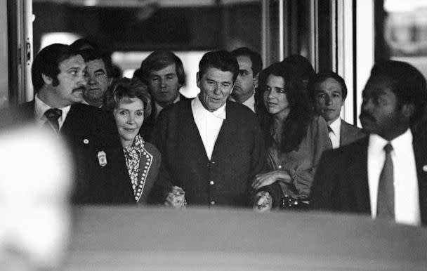 PHOTO: President Ronald Reagan, assisted by first lady Nancy Reagan and their youngest daughter, Patti Davis, leaves George Washington University Hospital in Washington after he was shot by John Hinckley, Jr., April 11, 1981. (Anonymous/AP)