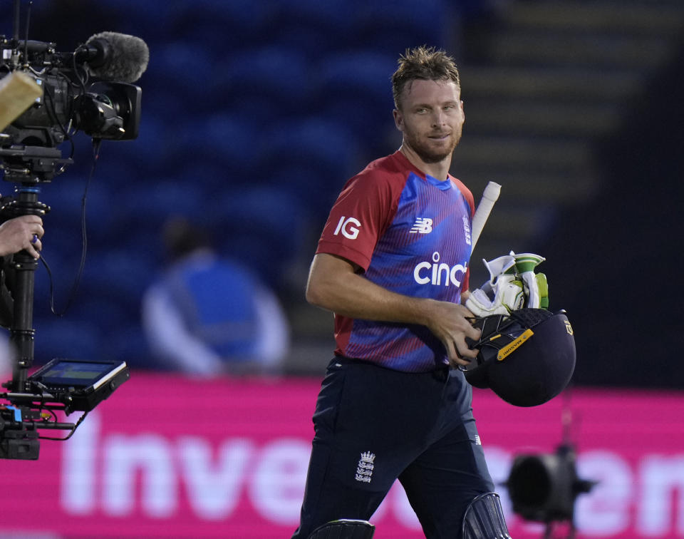 England's Jos Buttler smiles as he walks off the pitch after England won the T20 international cricket match between England and Sri Lanka at Cardiff, Wales, Wednesday, June 23, 2021. (AP Photo/Alastair Grant)