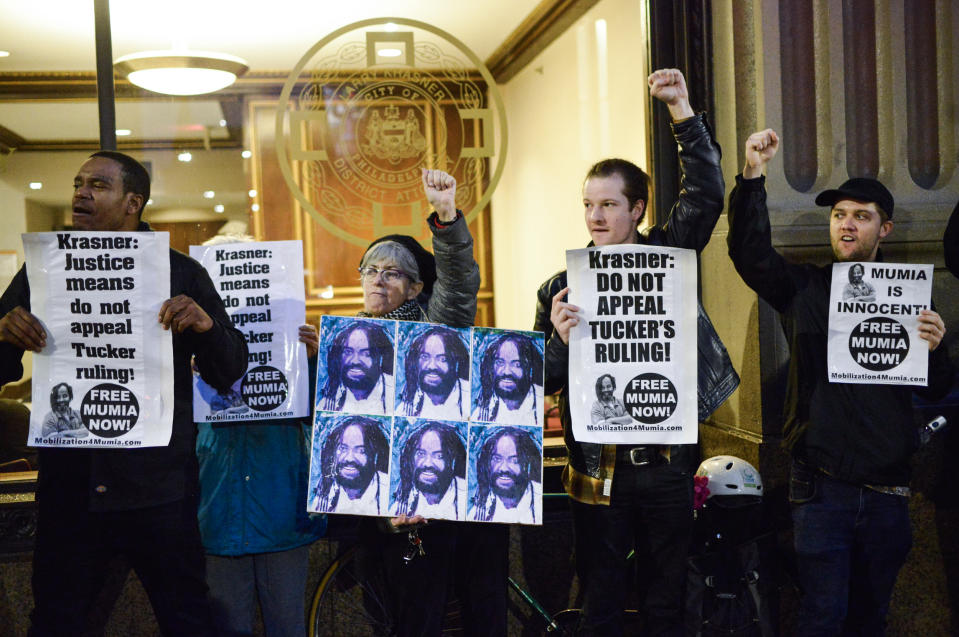 image: Fists are raised as activists rally outside the District Attorneys Office on December 12, 2018 to call on DA Larry Krasner to not appeal a recent decision of PA Supreme Court Justice Tucker in Philadelphia. ( Bastiaan Slabbers /  Getty Images)