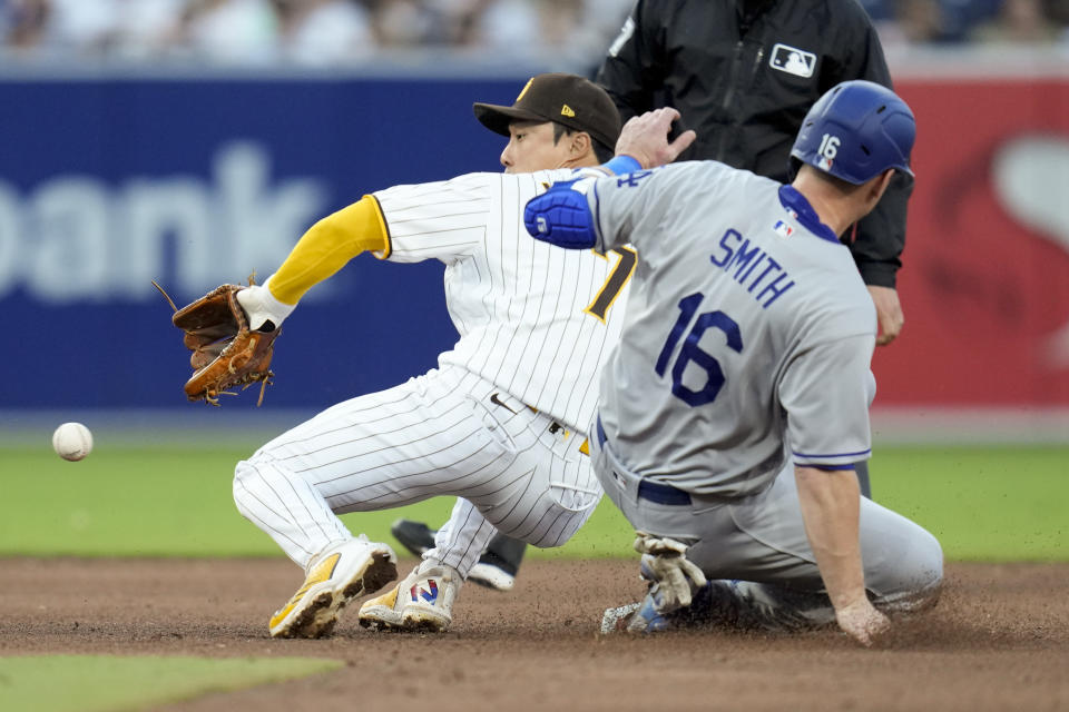 Los Angeles Dodgers' Will Smith (16) safely steals second base as San Diego Padres second baseman Ha-Seong Kim waits for the throw during the sixth inning of a baseball game Saturday, May 6, 2023, in San Diego. (AP Photo/Gregory Bull)