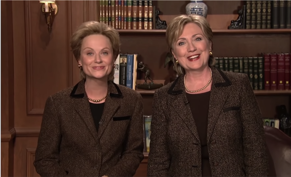 Amy Poehler next to Hillary Clinton