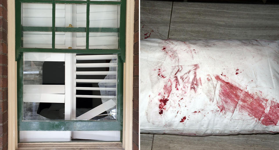 A broken window and a white pillow covered in blood. 