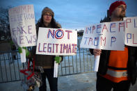 <p>Maggie Larson, left, and her husband Michael Larson travelled from Philadelphia to protester inauguration of Donald Trump on the National Mall on January 20, 2017 in Washington, DC. (Photo: Jessica Kourkounis/Getty Images) </p>