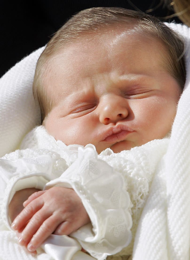 Princess Letizia Ortiz, wife of Spanish Crown Prince Felipe, holds sleeping daughter Princess Leonor during her media debut in Madrid, Spain, on 7 November 2005.