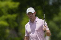 Rory McIlroy, right, of Northern Ireland, reacts to the crowd after making a birdie putt on the second green during the first round of the PGA Zurich Classic golf tournament at TPC Louisiana in Avondale, La., Thursday, April 25, 2024. (AP Photo/Gerald Herbert)