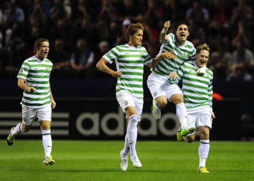 Celtic's Kris Commons (R) celebrates with teammates Adam Matthews (L), Thomas Rogne and Beram Kayal (2R) after scoring a goal during their Champions League play-off match against Helsingborgs on August 21