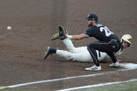 Notre Dame's Carter Putz (4) beats a throw back to first base as Mississippi State's Luke Hancock (20) waits for the ball during an NCAA college baseball super regional game, Sunday, June 13, 2021, in Starkville, Miss. (AP Photo/Rogelio V. Solis)