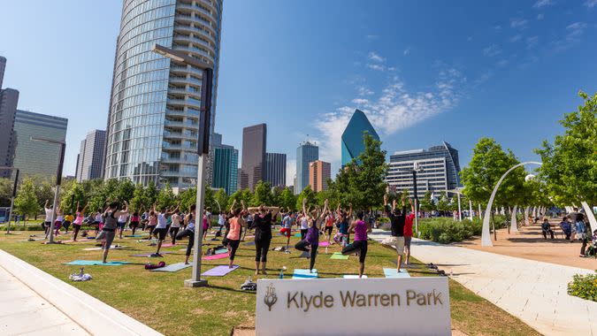 people practicing Yoga in Klyde Warren Park in Dallas Texas