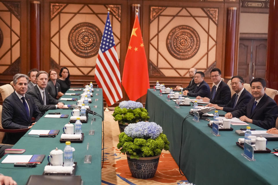 U.S. Secretary of State Antony Blinken, left, sits across the table from China's Minister of Public Security Wang Xiaohong, right, at the Diaoyutai State Guesthouse, Friday, April 26, 2024, in Beijing, China. (AP Photo/Mark Schiefelbein, Pool)