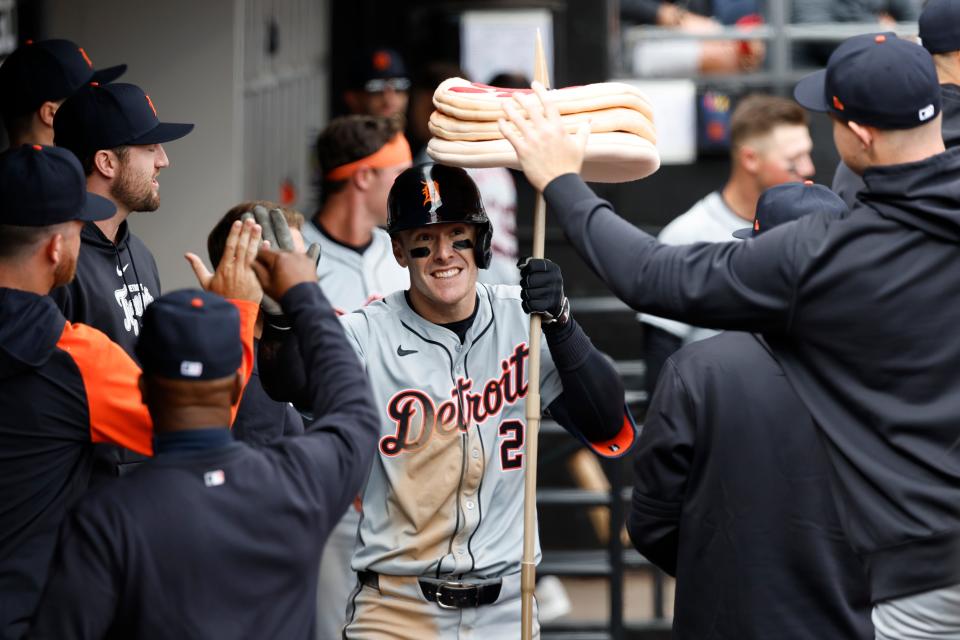 Detroit Tigers designated hitter Mark Canha celebrates with teammates after hitting a solo home run against the Chicago White Sox during the fifth inning at Guaranteed Rate Field, March 30, 2024.