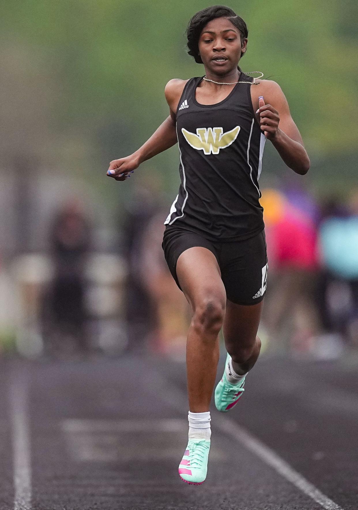 Warren Central's Jila Vaden competes in the 100 meter dash during the MIC Outdoor Championship on Friday, April 28, 2023 at Warren Central High School in Indianapolis.