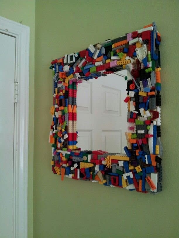 Mirror This mirror doesn’t even need building. Grab some superglue and stick random pieces to the frame of a mirror for a kooky finished effect. [Photo: lifehack.org]