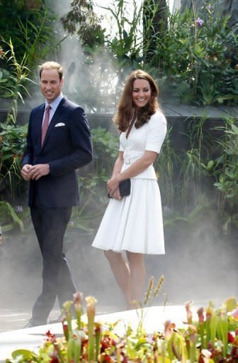 Prince William (L) and his wife Catherine, the Duchess of Cambridge, tour the Cloud Forest at Singapore's Gardens by the Bay on September 12. The couple planted a sapling in the Colonial Garden section