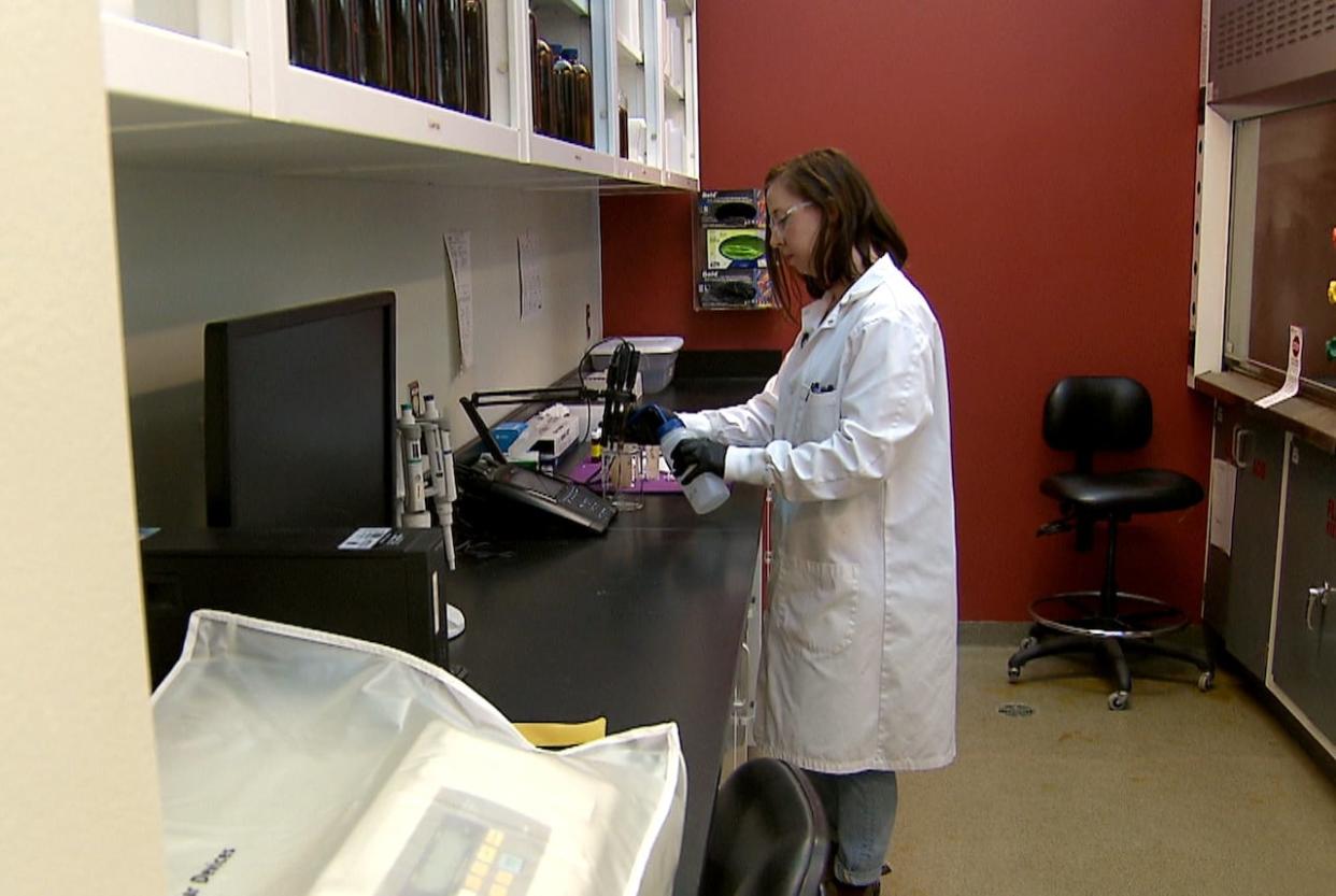 Kayla Moffett, an analytical chemist at ACWA, carries out work testing Calgary wastewater samples for traces of illicit drugs.  (Erin Collins/CBC - image credit)