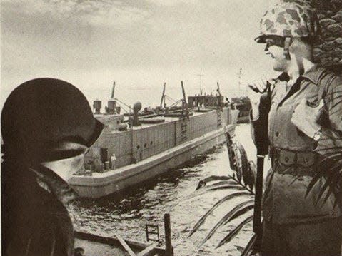 A page of Life Magazine published in 1945 shows an ad from the National Dairy Products Corporation with a photo of servicemembers observing the ice cream barge as it sails by.