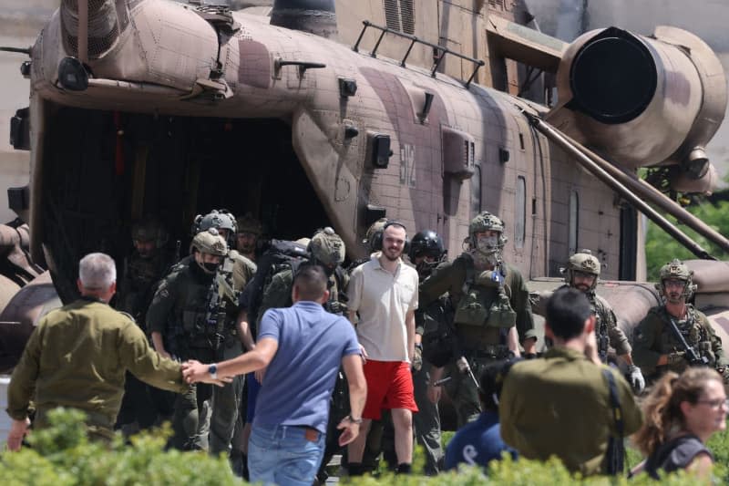 Andrey Kozlov (C), 27, one of the four Israeli hostages who were kidnapped by Hamas from the Nova music festival on 7 October, arrives by a helicopter at the Sheba Medical center in Ramat Gan. The Israel Defense Forces (IDF) said on Saturday that it had rescued four Israeli hostages in a "complex special daytime operation" in Nuseirat, a refugee camp in the central Gaza Strip. Ilia Yefimovich/dpa