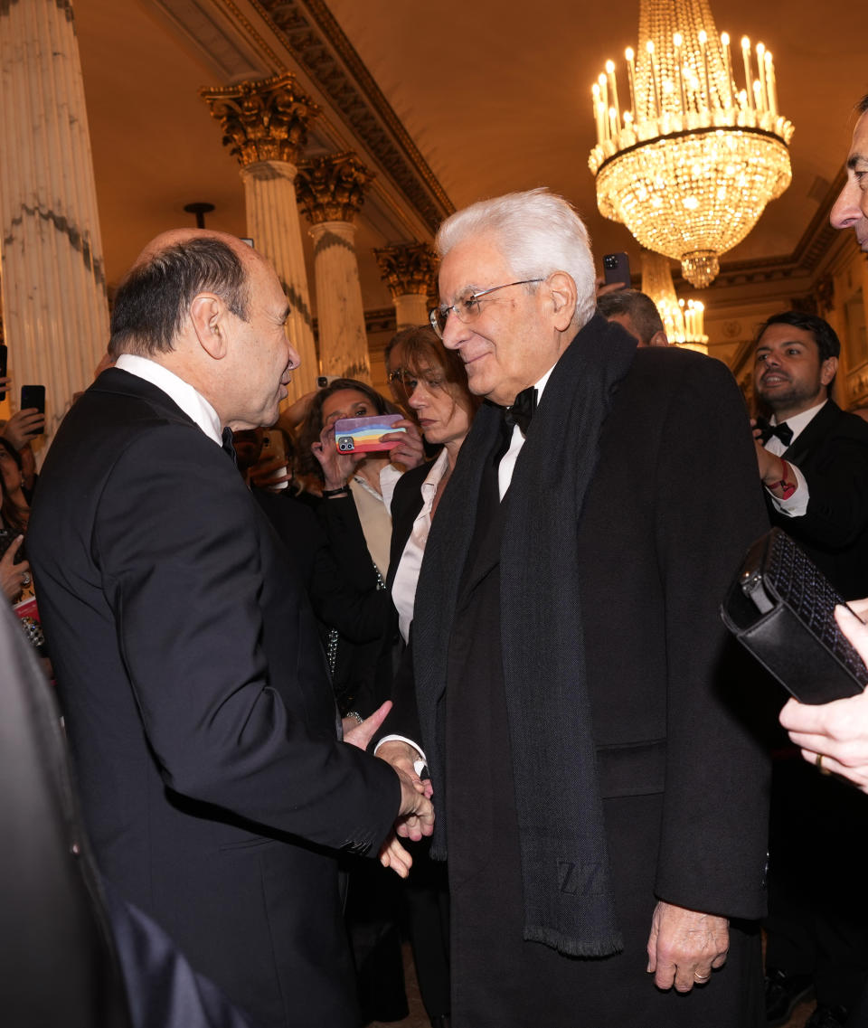 Italian President Sergio Mattarella is received by La Scala Superintendent Dominique Meyer as he arrives for the premiere of Modest Mussorgsky's Boris Godunov in Milan, Italy, Wednesday, Dec. 7, 2022. Italy’s most famous opera house, Teatro alla Scala, opened its new season Wednesday with the Russian opera “Boris Godunov,” against the backdrop of Ukrainian protests that the cultural event is a propaganda win for the Kremlin during Russia’s invasion of Ukraine. (AP Photo/Antonio Calanni)