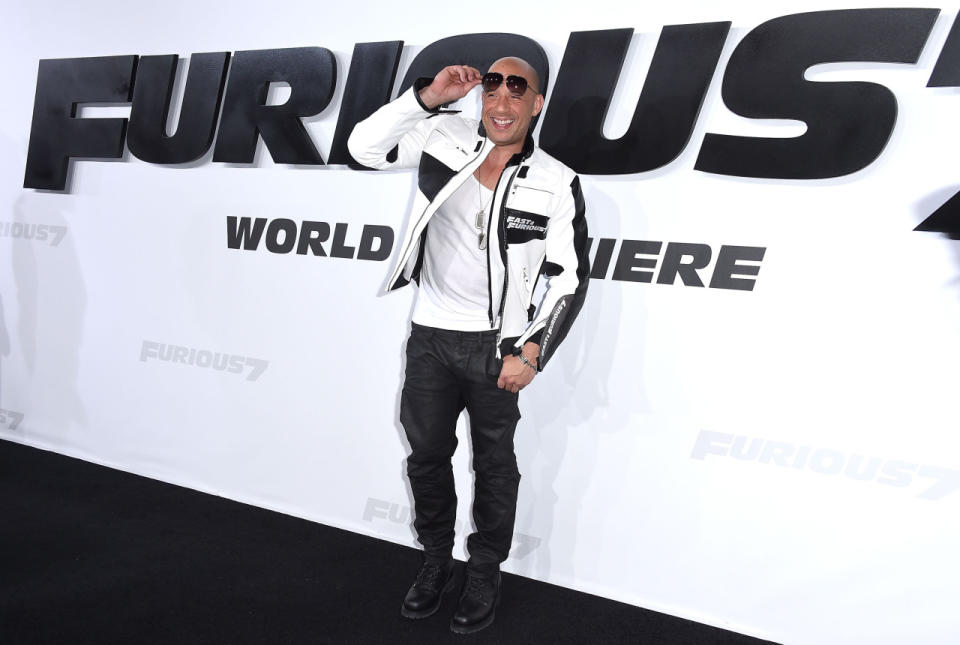 Vin Diesel basically stayed in character on the black carpet, wearing a custom black and white motorcycle jacket with “Fast & Furious” insignia. He paired it with leather pants, black boots, a white bro tank, dog tag necklaces, aviator sunglasses, and a sunkissed tan.