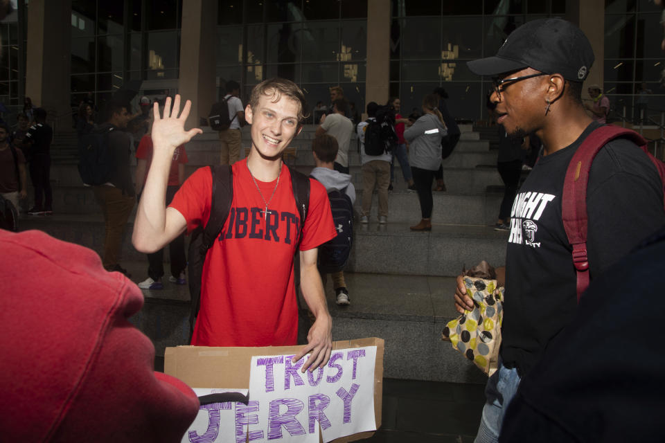 Garridy Hamilton, a freshmen in governments and policy, has a civil conversation with Jordan Addley, a senior in psychology, during a student protest on Friday, September 13, 2019 at Liberty University. (Emily Elconin/The News & Advance via AP)