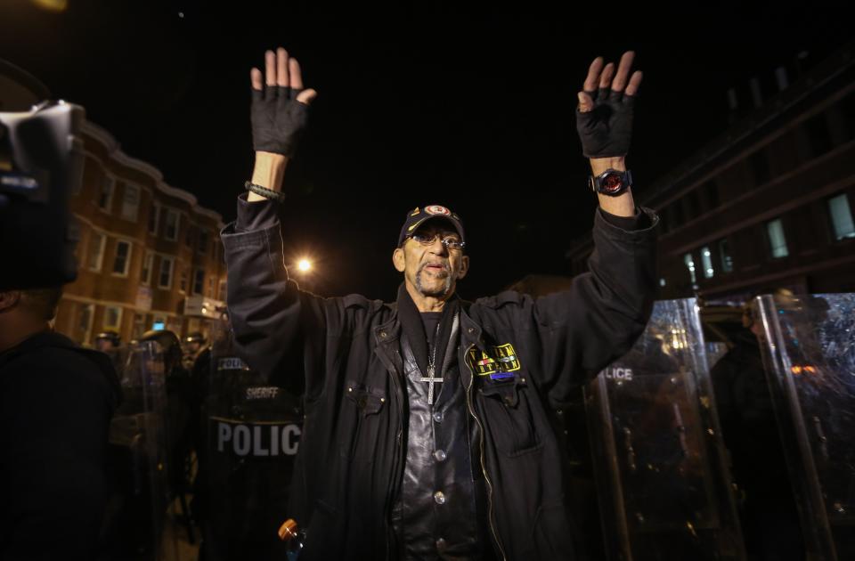 BALTIMORE, MD - APRIL 28:  A man reacts during a  curfew in Baltimore, Maryland, USA, 28 April 2015.  Tensions eased on 28 April after demonstrators kept rock-throwing protestors at bay from lines of police in riot gear. Hundreds of people were still out on the street after the 10 pm curfew passed. Police formed a wall against protestors who continued throwing plastic and glass bottles at them and officers threw smoke bombs and shot pepper spray pellets at the protesters. Demonstrations continue over the death of Freddie Gray, 25, an African-American who died on 19 April of injuries suffered in police custody. (Photo by Cem Ozdel/Anadolu Agency/Getty Images)