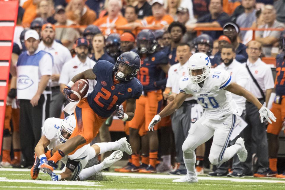 Syracuse RB Moe Neal accidentally ran over a ref against North Carolina. (Photo by Brett Carlsen/Getty Images)