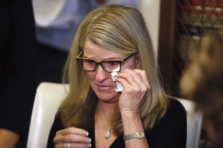 Linda Kirkpatrick, one of three women who allege they were sexually assaulted by comedian Bill Cosby, listens to a question after speaking at a news conference in Los Angeles, California, January 7, 2015. REUTERS/Lucy Nicholson