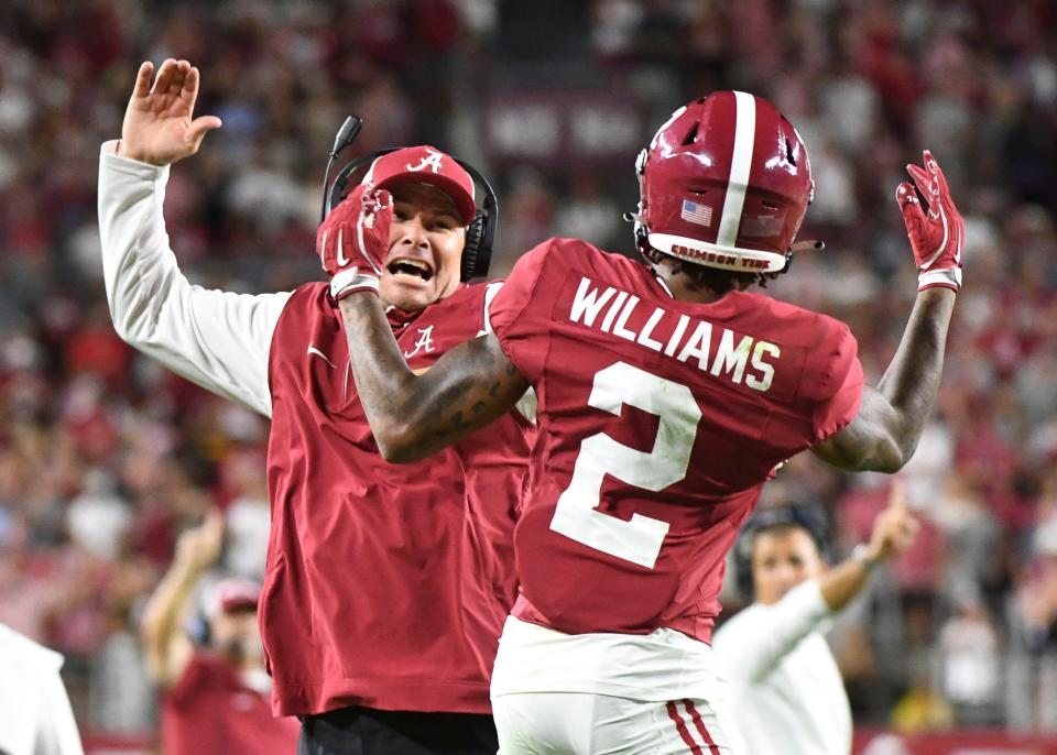 Sep 7, 2024; Tuscaloosa, Alabama, USA; An Alabama assistant celebrates with Alabama Crimson Tide wide receiver Ryan Williams (2) after he scored a touchdown at Bryant-Denny Stadium. Alabama defeated South Florida 42-16. Mandatory Credit: Gary Cosby Jr.-Imagn Images