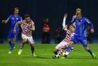 Football Soccer - Croatia v Ukraine - 2018 World Cup Qualifiers European Zone - Maksimir arena, Zagreb, Croatia - 24/03/17. Ukraine's Viktor Kovalenko and Croatia's Luka Modric in action. REUTERS/Antonio Bronic