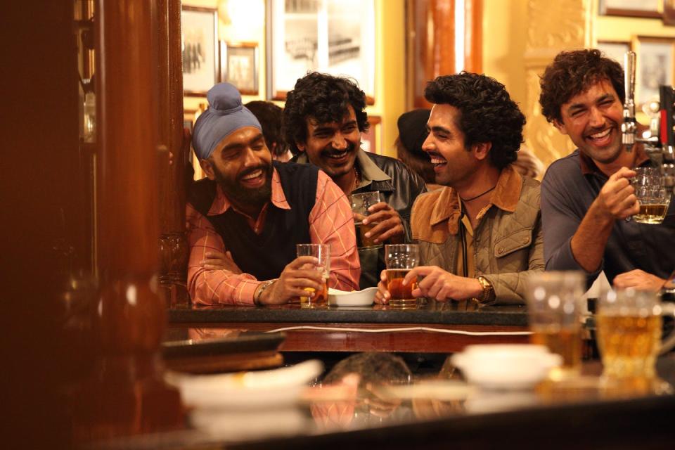 Four Indian men at a pub.