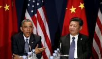 U.S. President Barack Obama meets with Chinese President Xi Jinping at the start of the two-week climate summit in Paris, France November 30, 2015. REUTERS/Kevin Lamarque