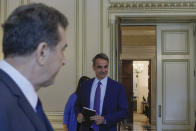 Greece's Prime Minister Kyriakos Mitsotakis, arrives for a meeting regarding the migration policy, in Athens, Monday, July 15, 2019. (AP Photo/Petros Giannakouris)