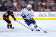 Tampa Bay Lightning's Victor Hedman (77) skates past Philadelphia Flyers' Cam Atkinson (89) during the second period of an NHL hockey game, Sunday, Dec. 5, 2021, in Philadelphia. (AP Photo/Matt Slocum)