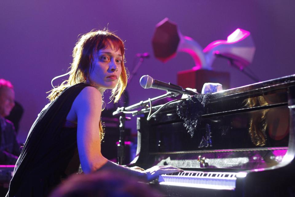 FILE - This March 14, 2012 file photo shows Fiona Apple performing at the NPR showcase during the SXSW Music Festival in Austin, Texas. Apple has been arrested for hashish possession at a West Texas town after a Border Patrol drug-sniffing dog detected marijuana in her tour bus. Sierra Blanca Sheriff's office spokesman Rusty Flemming says the artist spent Wednesday, Sept. 19, at the Hudspeth County jail and would be bonded out Thursday. Fleming says Apple "had a little tiny amount of pot and hash." Fleming says marijuana possession in small amounts is a misdemeanor, while hashish in any quantity is a felony in Texas. (AP Photo/Jack Plunkett, file)