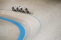 Members of the German men's track cycling team round the track during a training session inside the Izu velodrome at the 2020 Summer Olympics, Thursday, July 29, 2021, in Tokyo, Japan. (AP Photo/Thibault Camus)