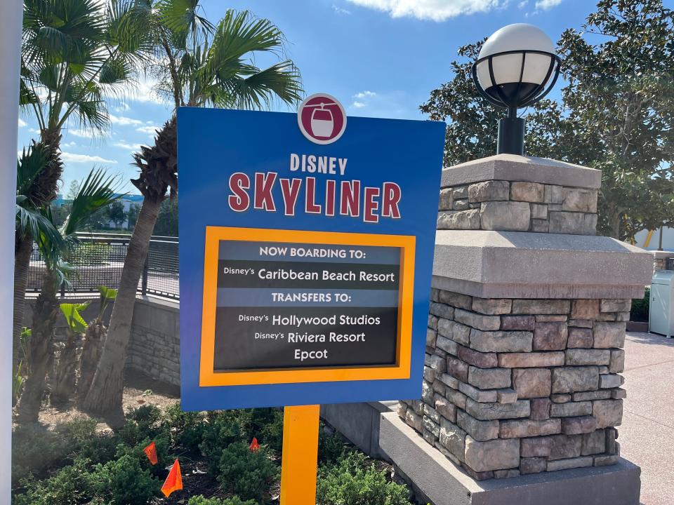 sign for the disney skyliner at pop century resort in disney world