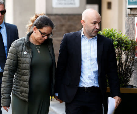 Marcio and Andreia Gomes, parents of Logan Gomes, arrive for a commemoration hearing at the opening of the inquiry into the Grenfell Tower disaster, in London, Britain May 21, 2018. REUTERS/Henry Nicholls