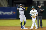 New York Yankees' Oswaldo Cabrera, left, reacts after hitting an RBI-double against the Oakland Athletics during the seventh inning of a baseball game in Oakland, Calif., Thursday, Aug. 25, 2022. (AP Photo/Godofredo A. Vásquez)