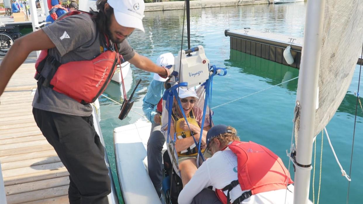 Harnesses allow sailors to be lowered into and lifted from the boats. (Laura Pedersen/CBC - image credit)